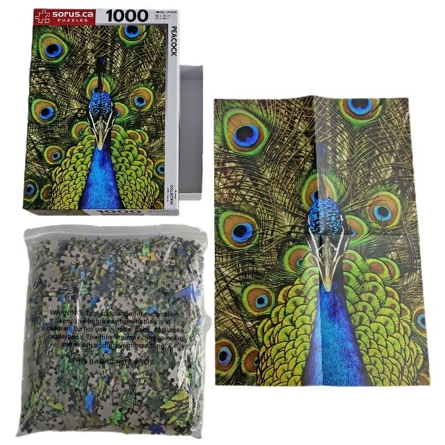 Puzzle box contents of blue and green Peacock 1000 piece jigsaw puzzle by Sorus Puzzles